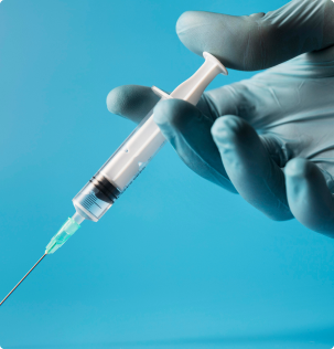 image of a hand holding an injection