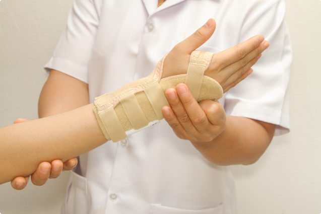 doctor checking the wrist brace of a person