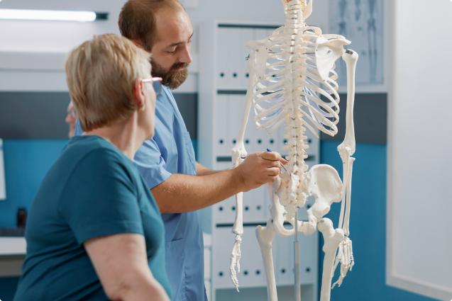 doctor and patient examining the skeleton